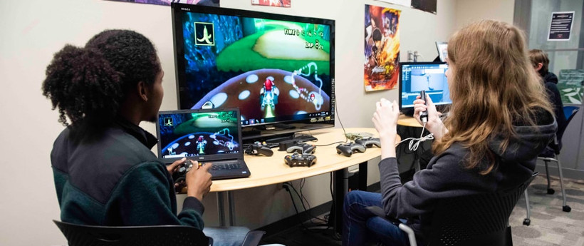 two students testing a video game