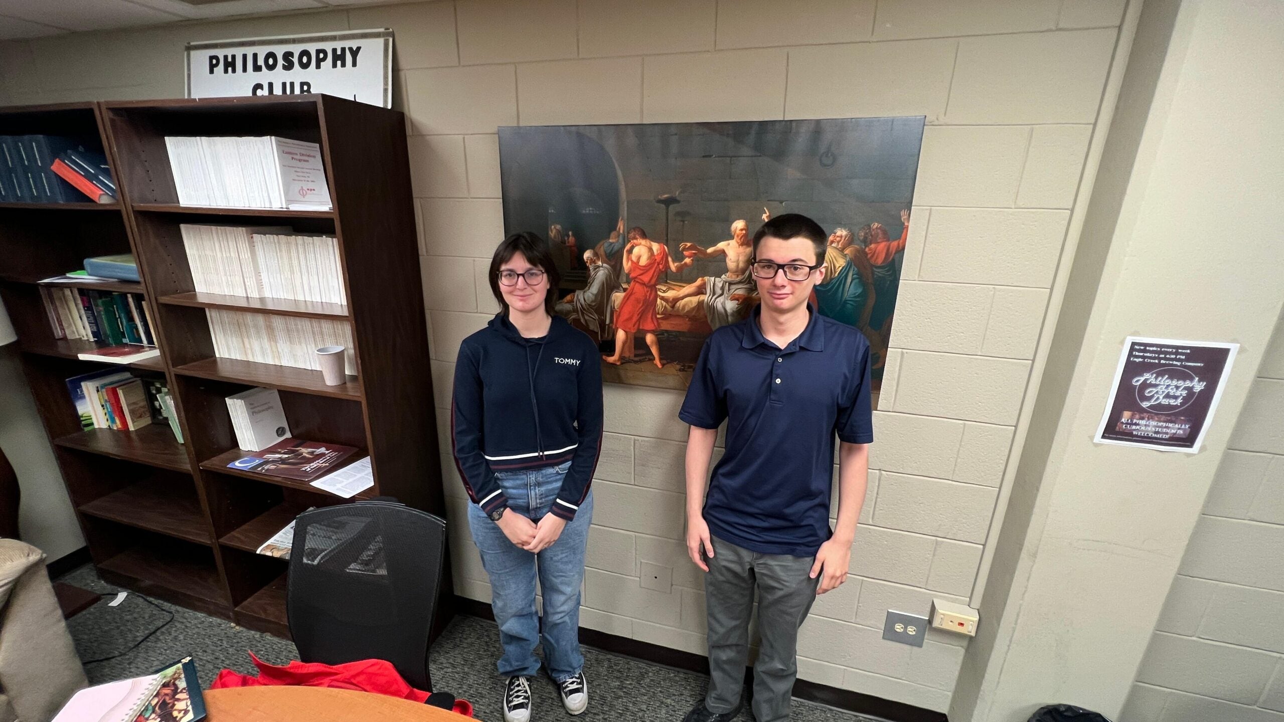 Logan Collin (left) and Cade Huff (right) stand in their Ethics Team practice room, where many of their meetings are held and arguments formulated.