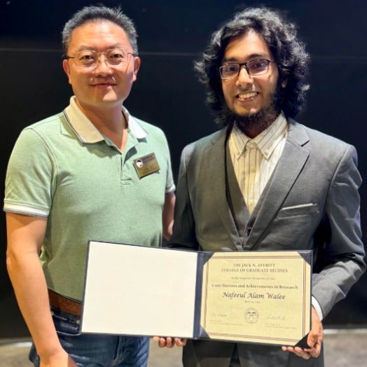 Nafeeul Walee shows off his award with Dr. Lei Chen.