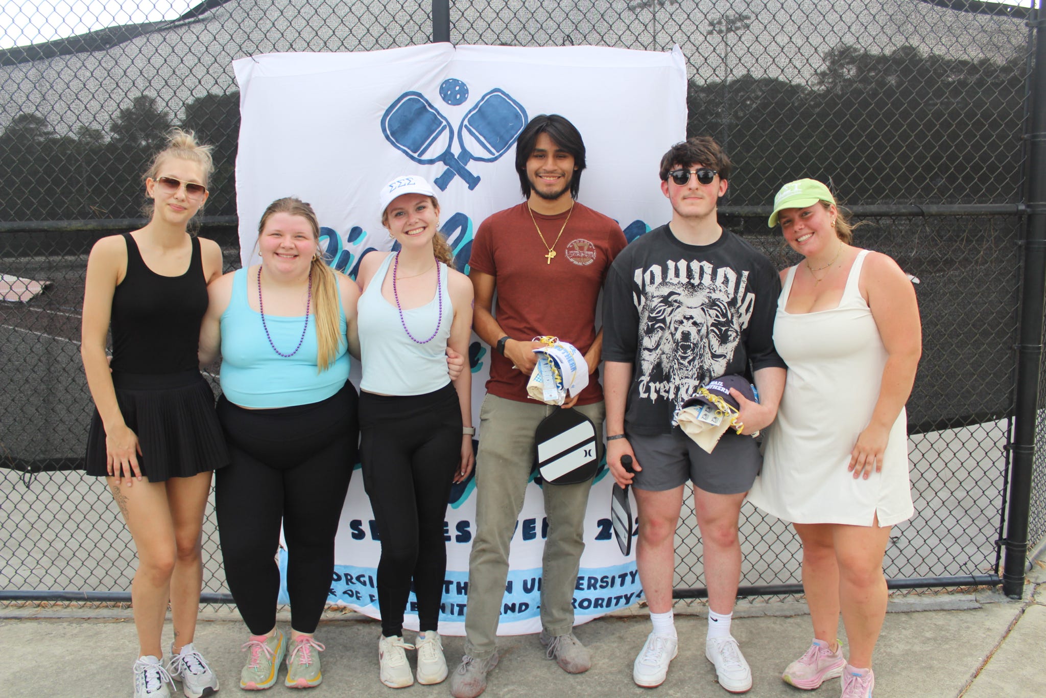 Students pose at community fundraiser.
