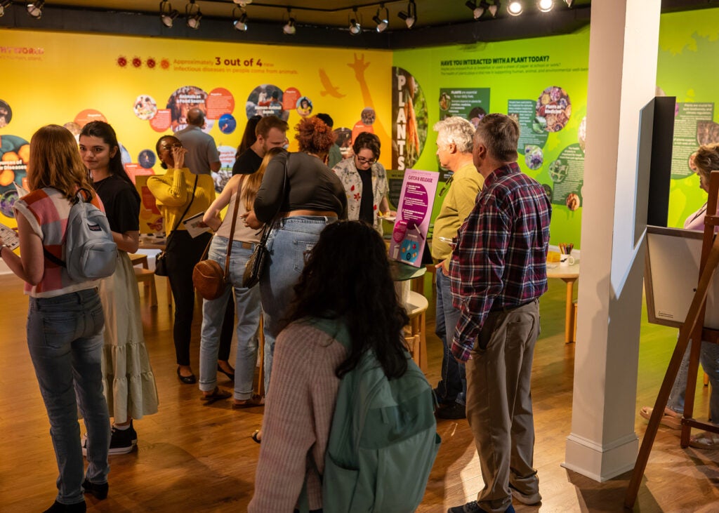 Visitors tour One Health exhibit