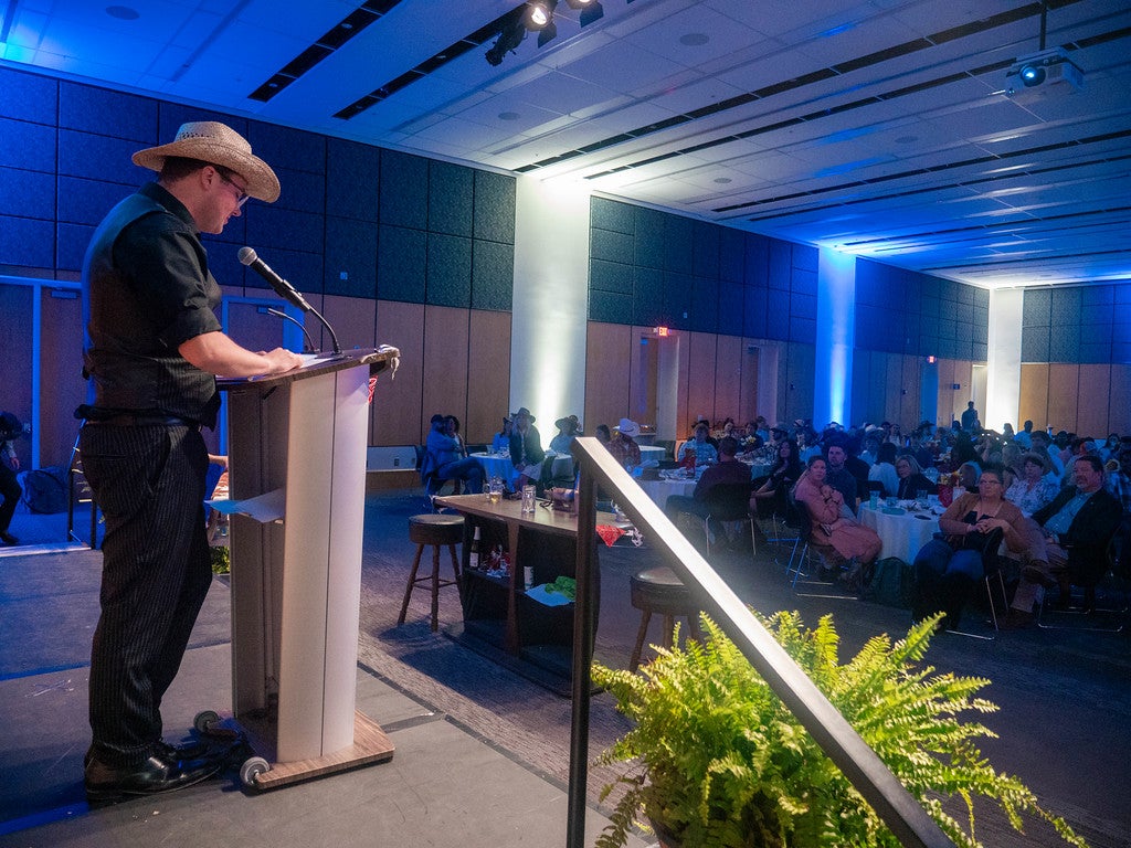 A presenter give a speech at the CRI end of year awards for recreation and intramural sports.