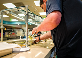 A Georgia Southern students serves himself at the food bar buffet.