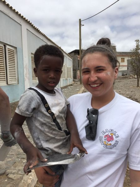 Cantrall poses with a child during her trip to Africa.