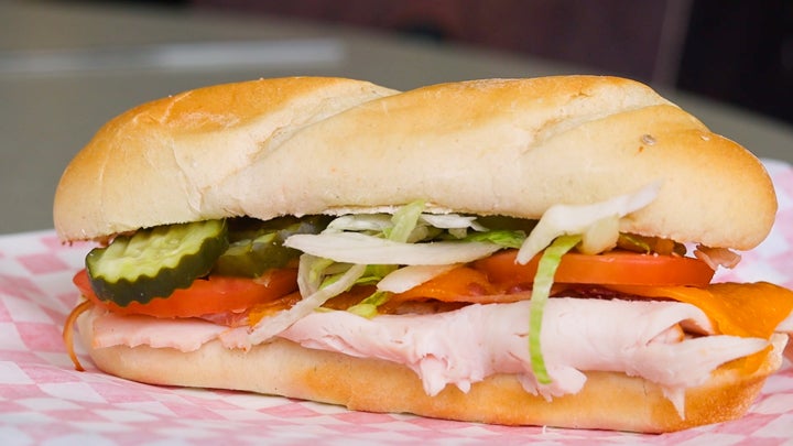 A turkey sub sandwich with loads of toppings.
