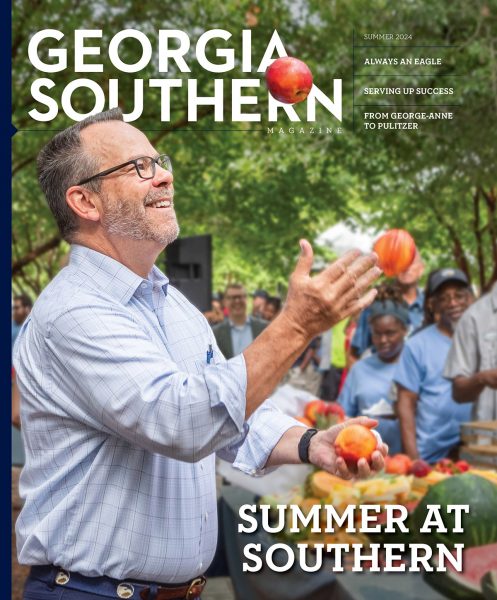 The cover of Georgia Southern magazine, Summer 2024 issue titled Summer at Southern features President Marrero juggling fruit at the summer celebration.