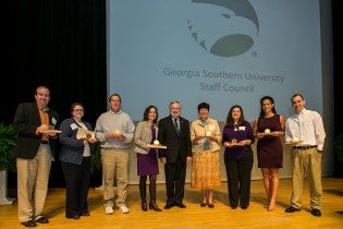 During the event, eight staff members were honored with Awards of Merit. From left:  Jeff Blythe, Sara Bailey, Michael Bochian (on behalf of Jesse Hopkins), Jaynie Gaskin, Dr. Brooks Keel, Valarie Kasay, Lynn Reaves, America Minc and Joshua Williams.