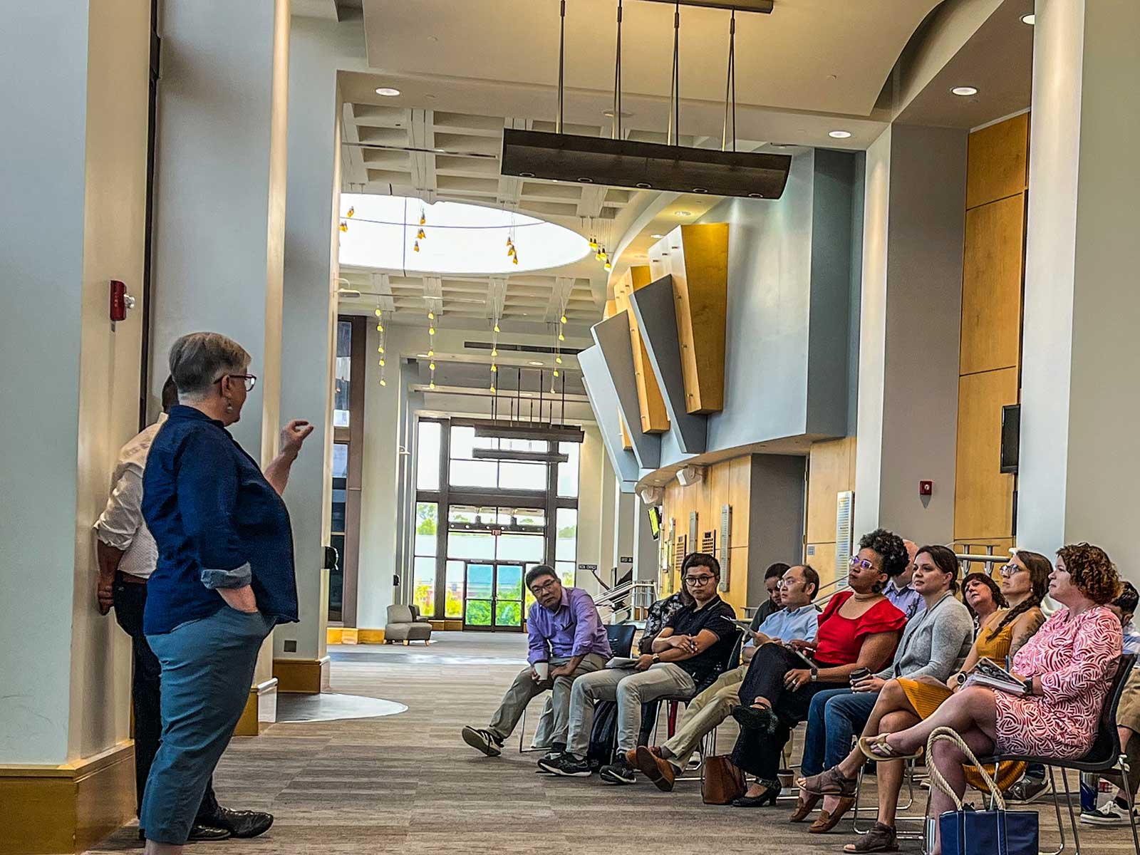 A group setting where fellow faculty addressing other members