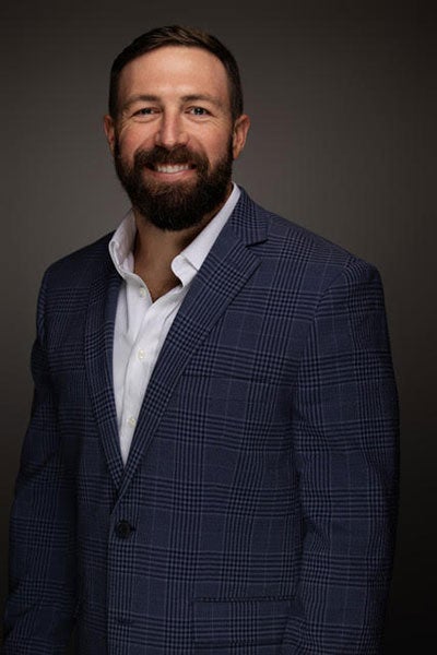 Headshot of Featured Speaker at Topcon Chris Juneau