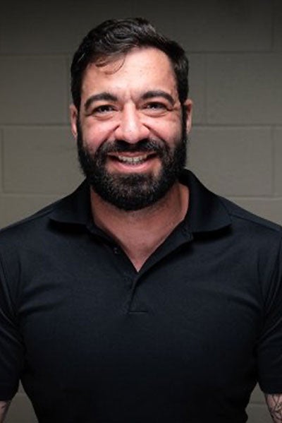 Headshot of Featured Speaker at Topcon Mark