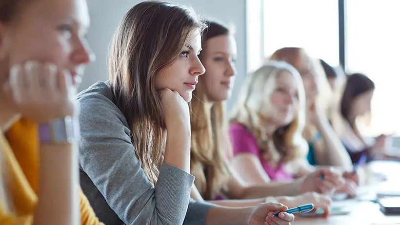 Photo of students sitting eager to learn