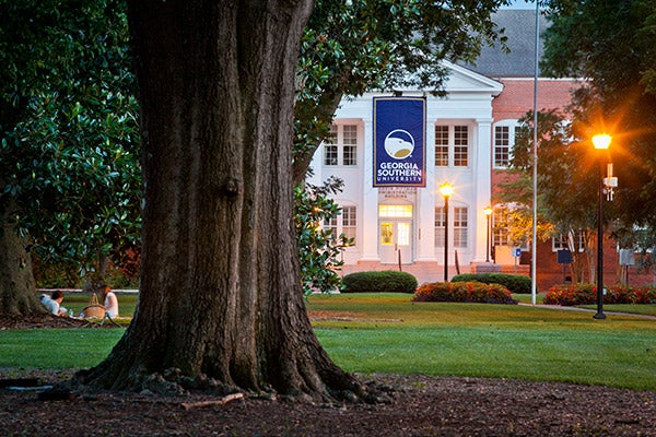 Georgia Southern female student sitting in classroom with diverse group of students sitting behind her