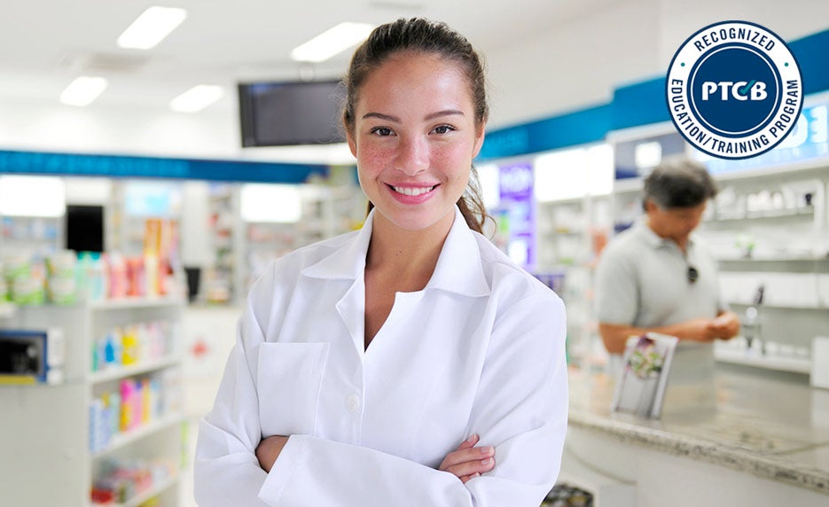 Smiling female pharmacist in a white coat stands in a bright pharmacy, badge for PTCB recognized education program visible in the corner.