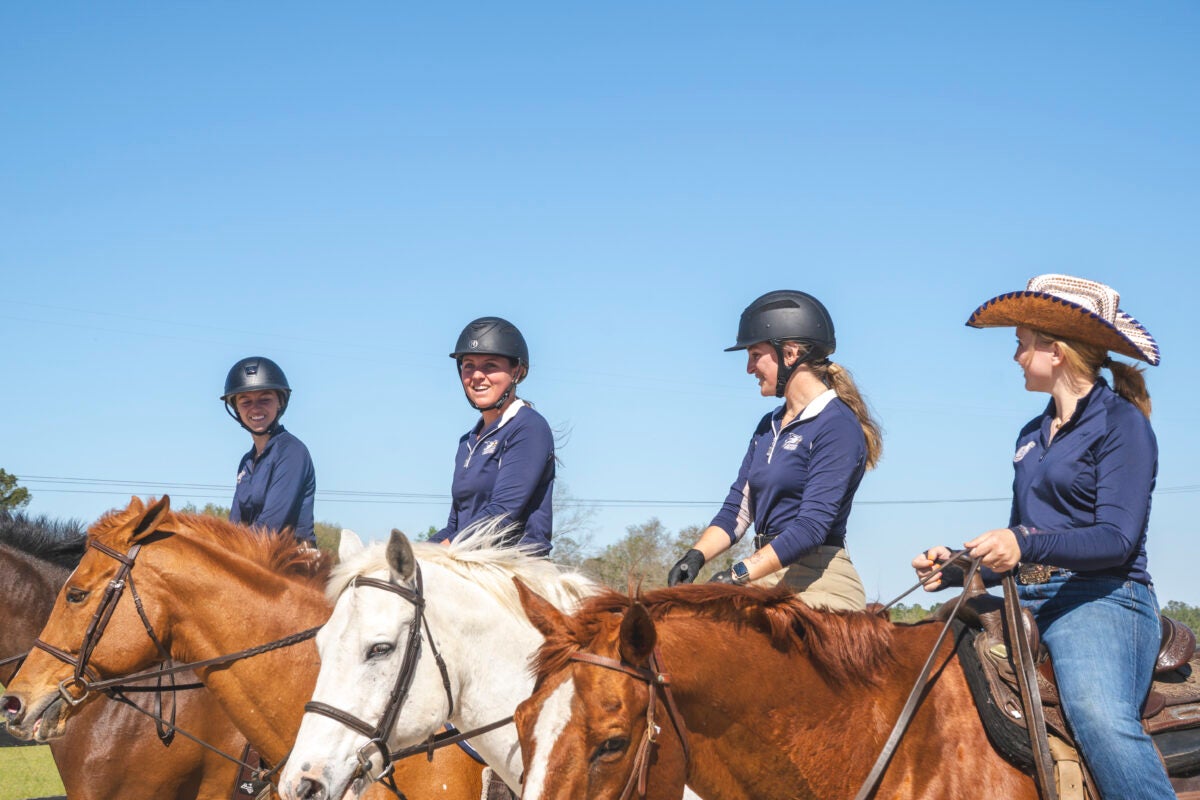 4 Students on the back of horses