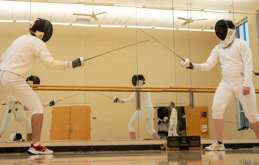 Students practicing fencing