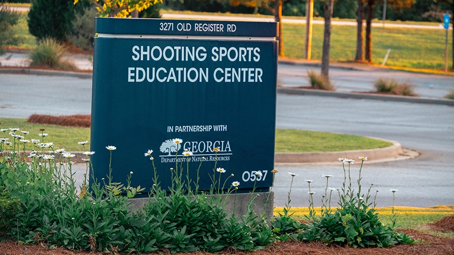 Sign for Shooting Sports Education Center at 3271 Old Register Rd, partnered with Georgia Department of Natural Resources.