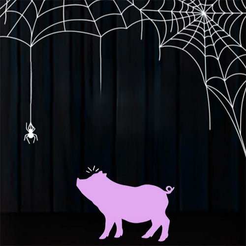 Purple cow-like silhouette stands on a dark stage beneath oversized white spider webs, with a hanging white spider from above.